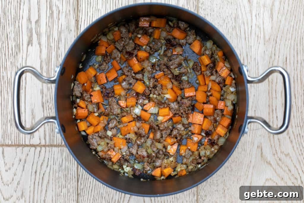 sausage, carrots, onion, and garlic sautéed in large pot