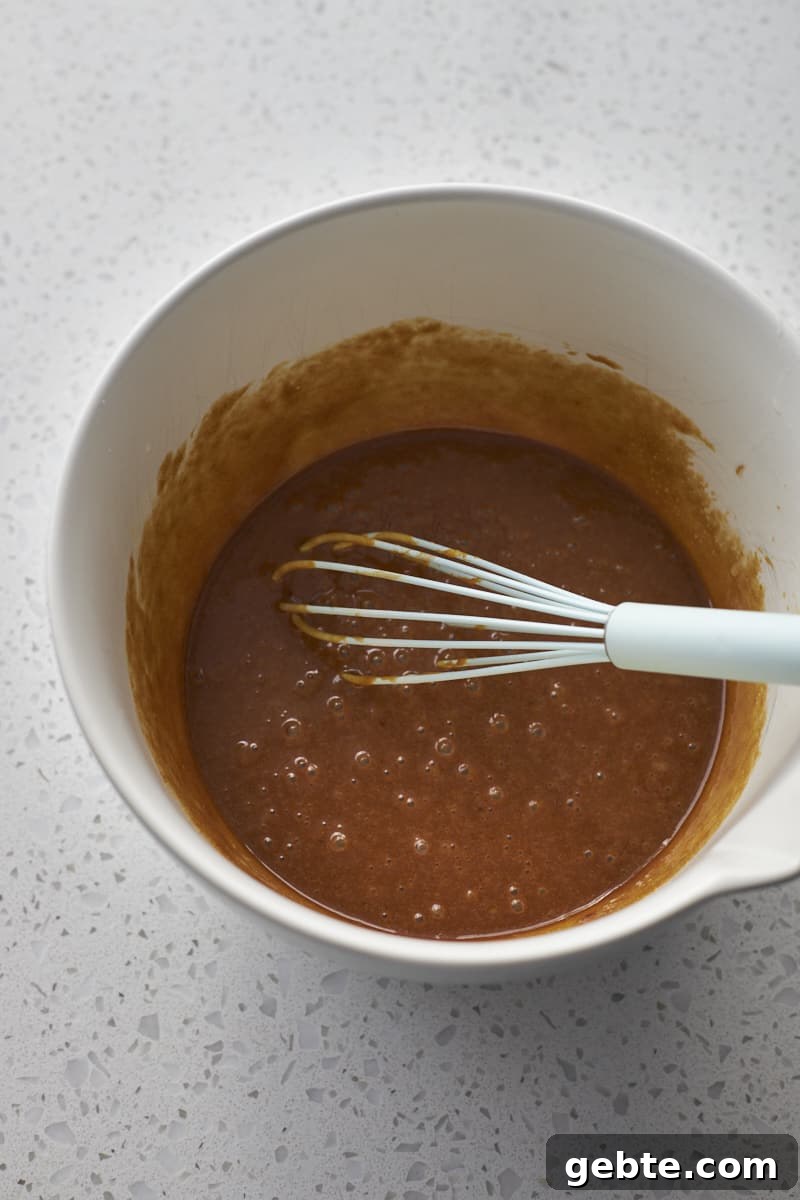 Wet ingredients whisked together in a large bowl.