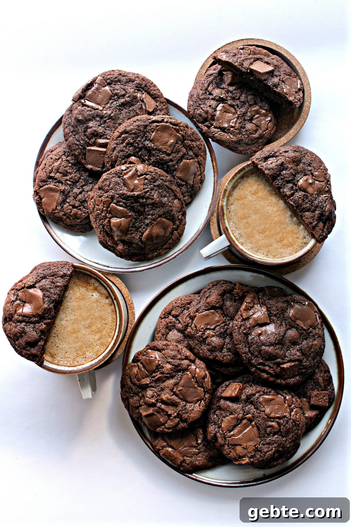 Chocolate Chip Mocha Cookies on plates with two cups of coffee.