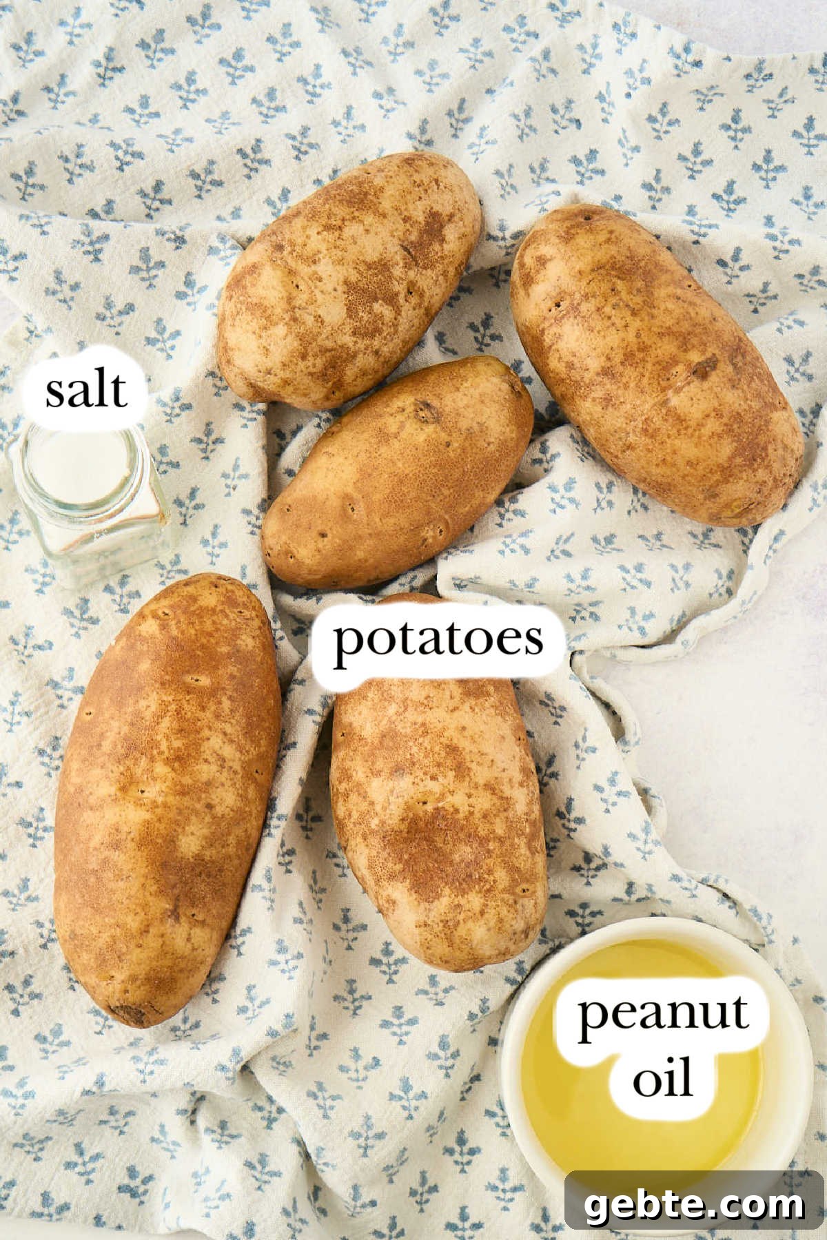 Crispy Deep-Fried French Fries: Step-by-Step Recipe Guide 3 ingredients on blue and white tea towel.