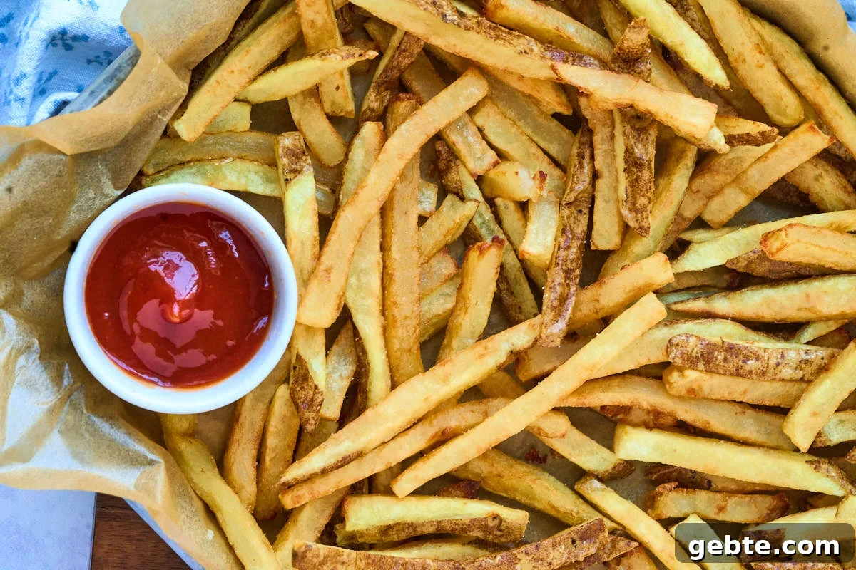Crispy Deep-Fried French Fries: Step-by-Step Recipe Guide 8 fries with ramekin of ketchup.