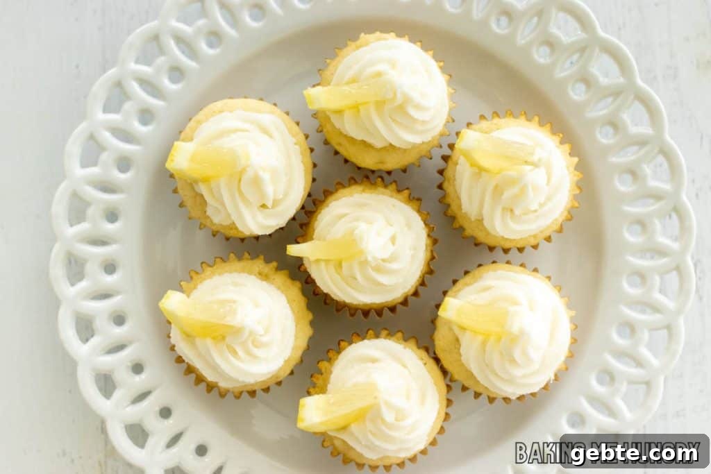 mini lemon cupcakes on decorative white plate from overhead
