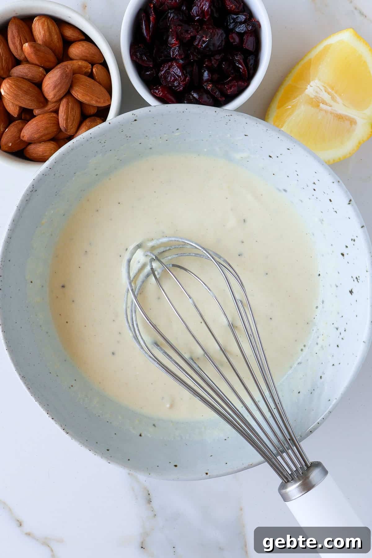 Chicken, Broccoli and Kale Salad with Lemon-Garlic Dressing 7 Tahini yoghurt dressing in a bowl with a whisk.