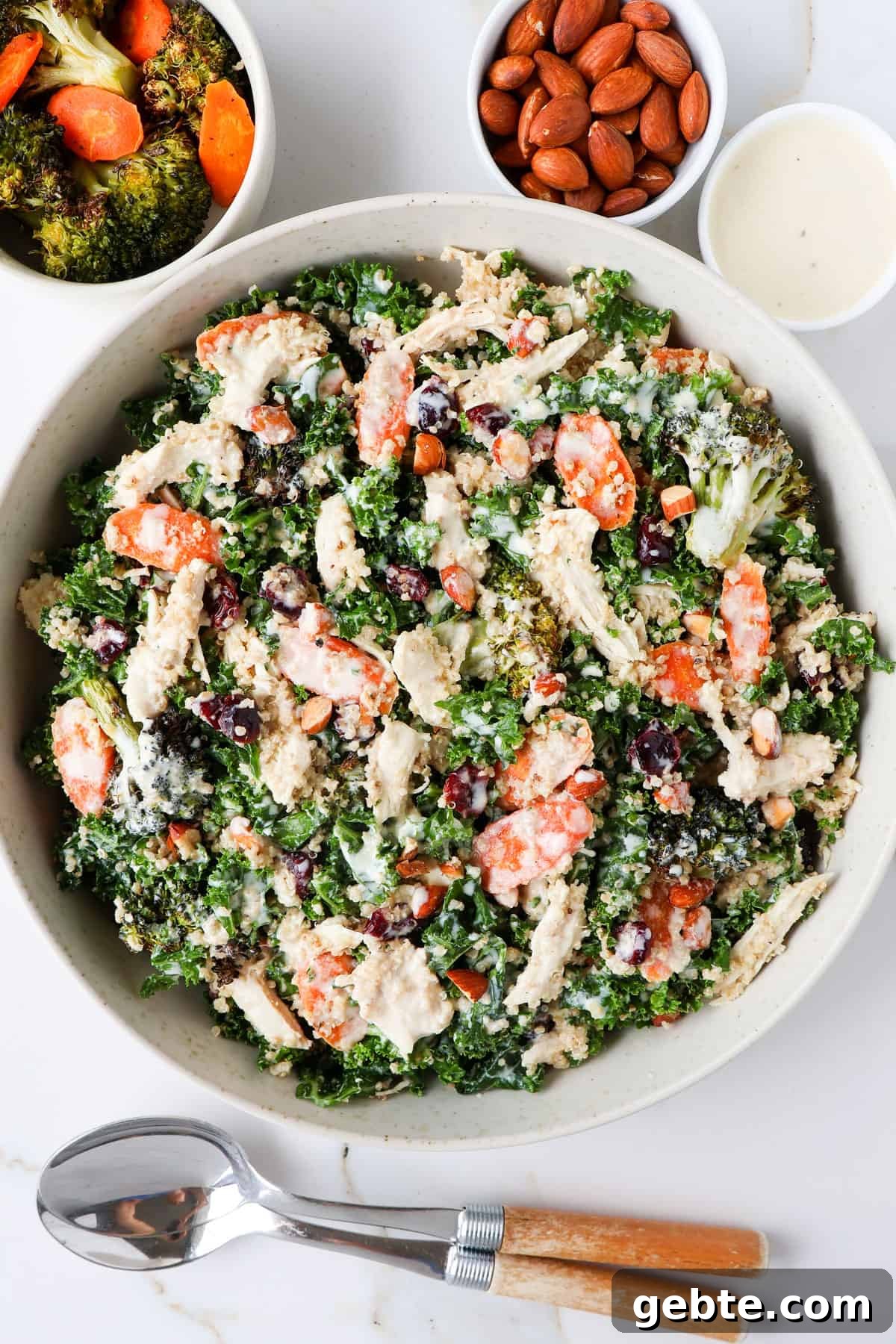 Chicken, Broccoli and Kale Salad with Lemon-Garlic Dressing 10 Chicken, broccoli and kale salad served in a bowl with spoons.