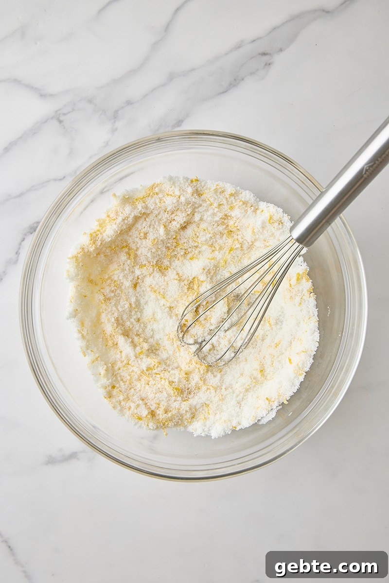 Lemon-sugar whisked together in glass bowl