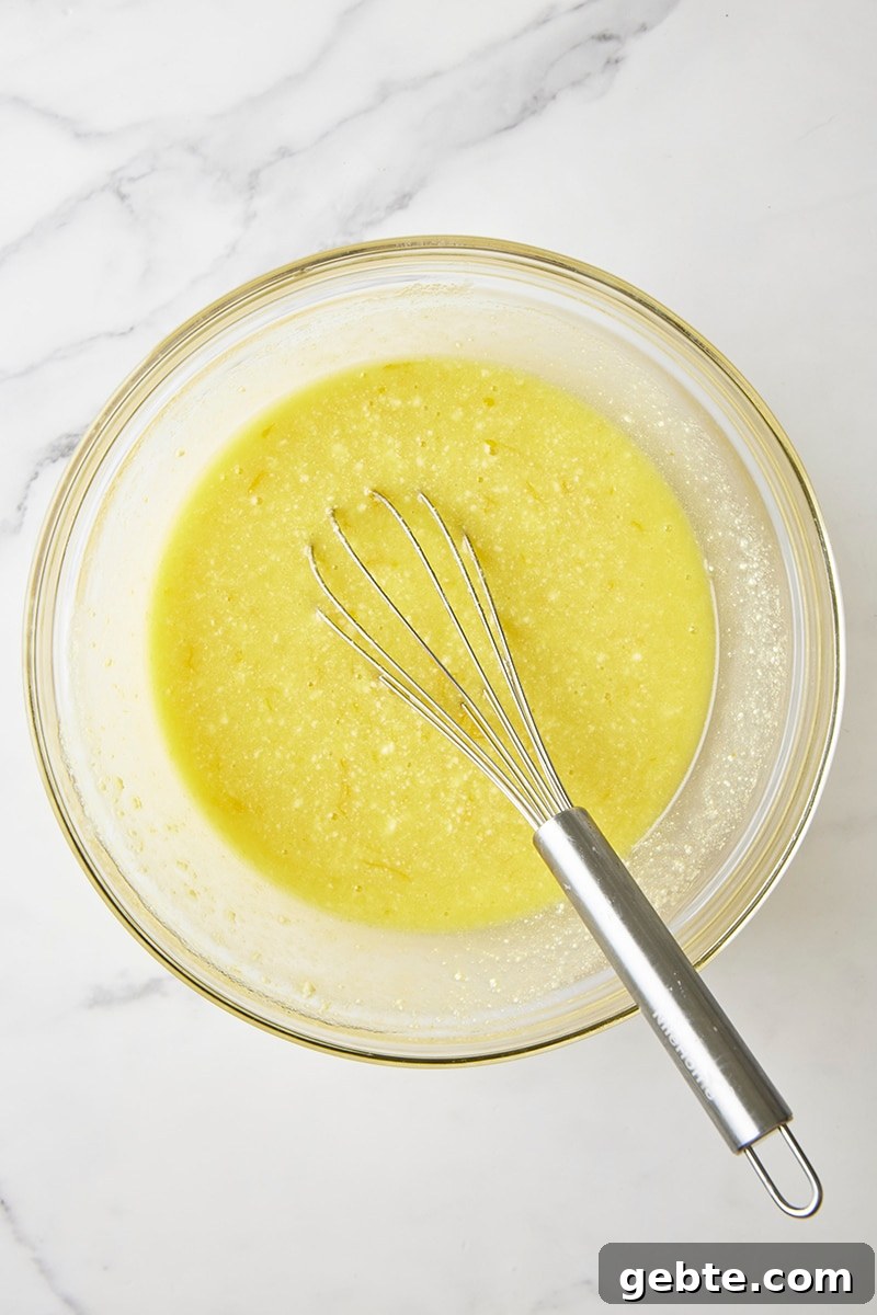 Wet ingredients whisked together in glass bowl