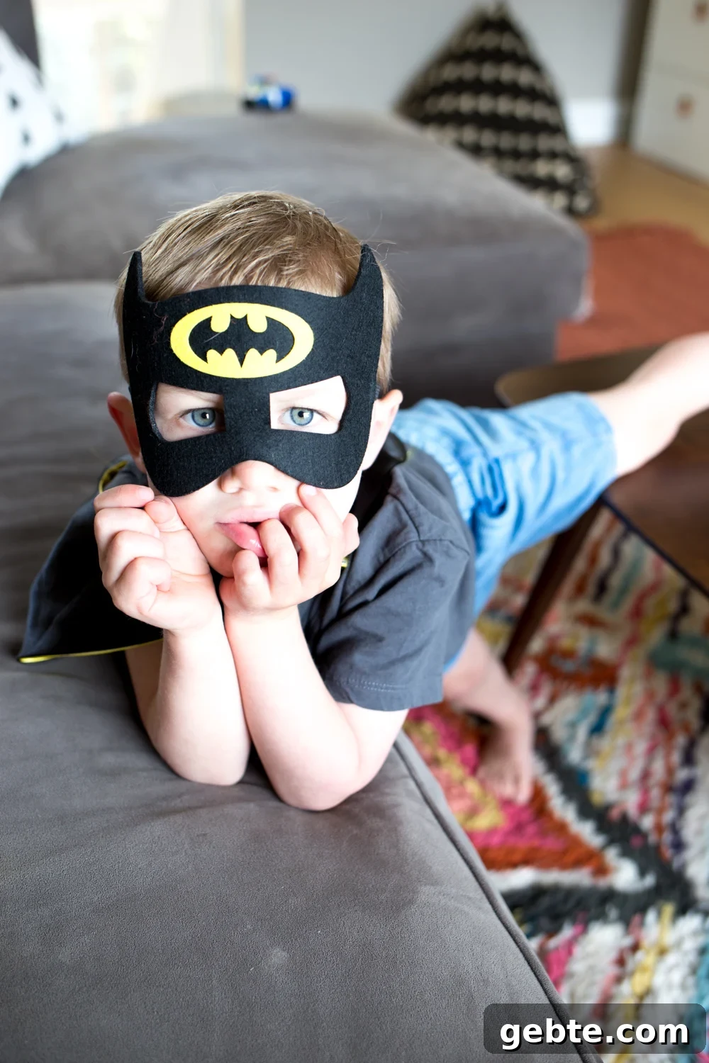 Declutter Toys Quickly: Smart Steps to Organize Kids’ Playroom 3 toddler boy with batman mask on in play room