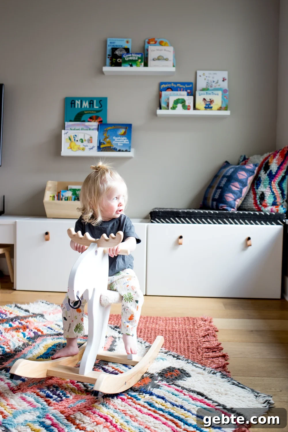 Declutter Toys Quickly: Smart Steps to Organize Kids’ Playroom 4 cute toddler girl on rocking moose in play room