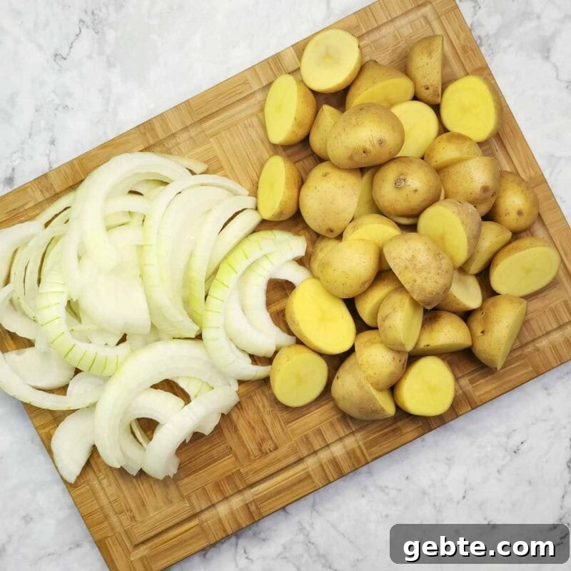 Peel and slice the onion. Wash the baby potatoes and cut them in half.