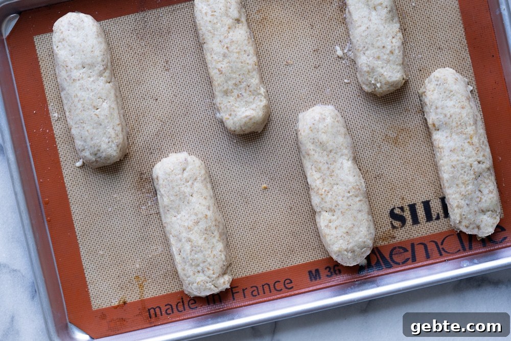 Keto Hot Dogs with Fluffy Yeast Buns: Low-Carb Recipe 4 Keto hot dog buns with yeast before rise on a baking tray