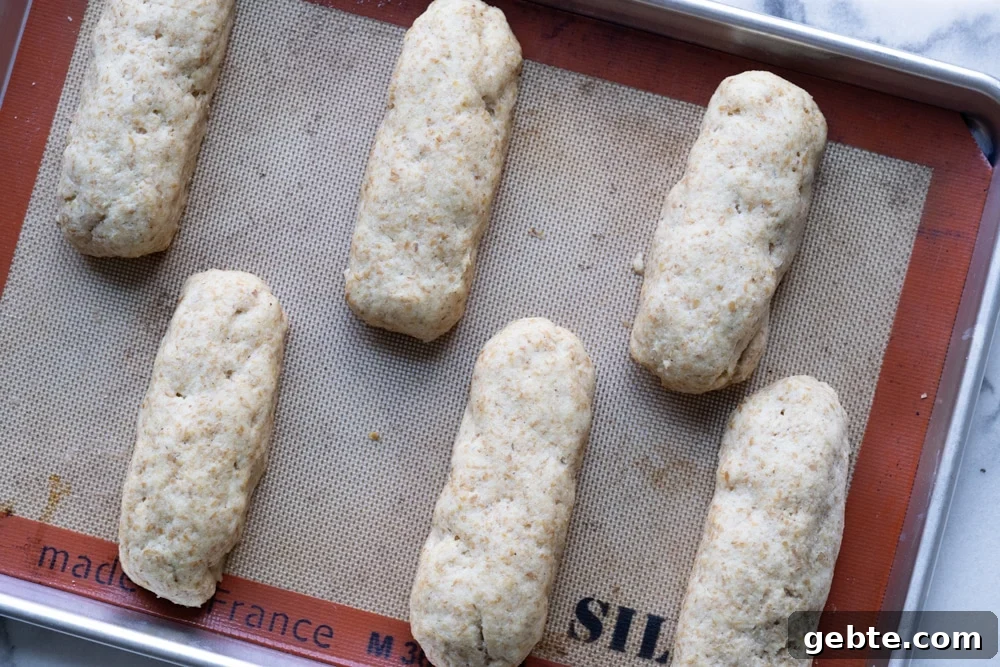 Keto Hot Dogs with Fluffy Yeast Buns: Low-Carb Recipe 5 Keto hot dog buns with yeast after rise on a baking tray