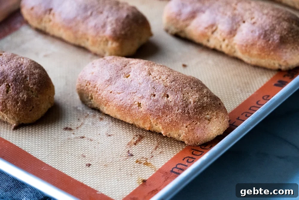Keto Hot Dogs with Fluffy Yeast Buns: Low-Carb Recipe 6 Freshly baked Keto hot dog buns on a baking tray