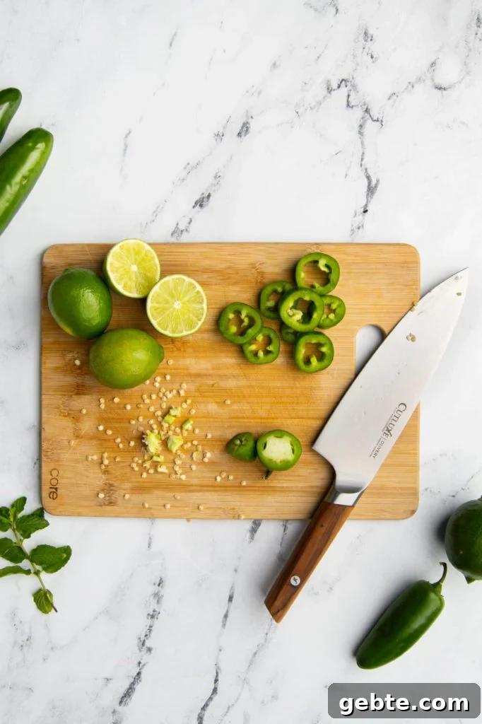 sliced jalapeno spheres with seeds taken out on a cutting board