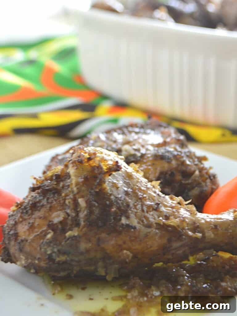 Chicken drumstick on a white plate.