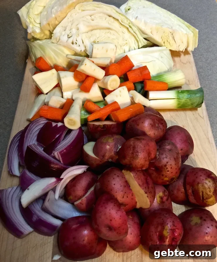 Corned Beef and Cabbage, vegetables prepped on cutting board.