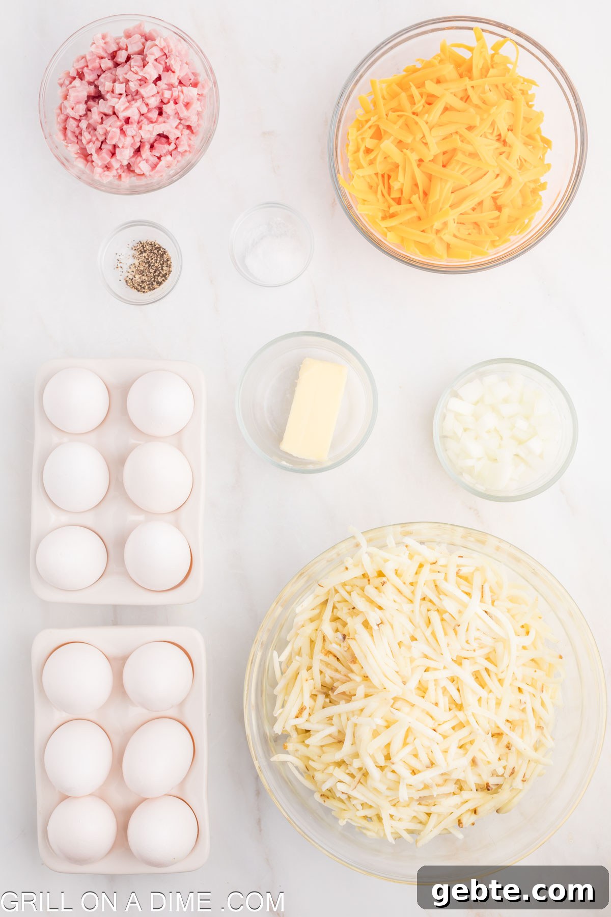 Ingredients needed for hashbrown omelette - hashbrowns, butter, eggs, cheddar cheese, ham, onion, salt and pepper