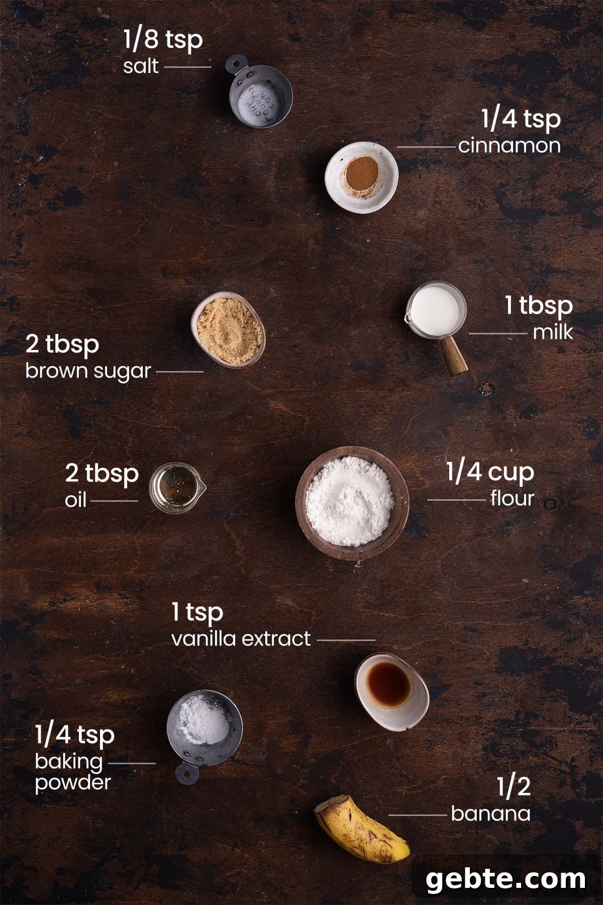 all ingredients for banana bread mug cake - salt, cinnamon, brown sugar, milk, oil, flour, vanilla extract, baking powder, banana
