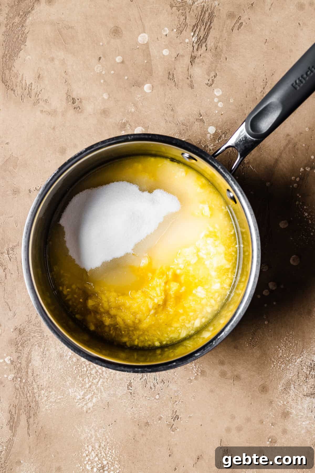 Fresh pineapple puree, granulated sugar and lime juice in a pot.
