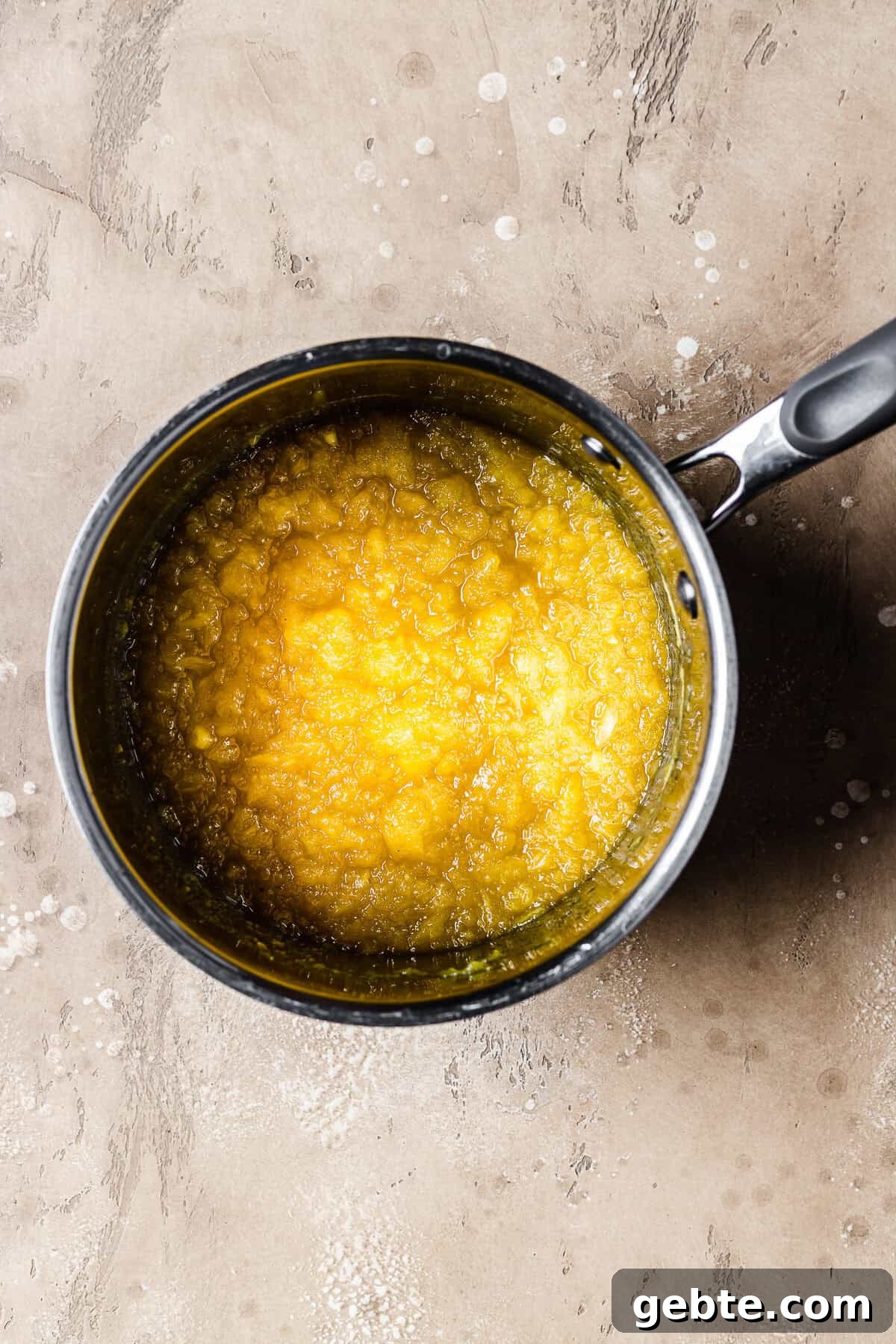 A cooked pot of fresh pineapple jam.