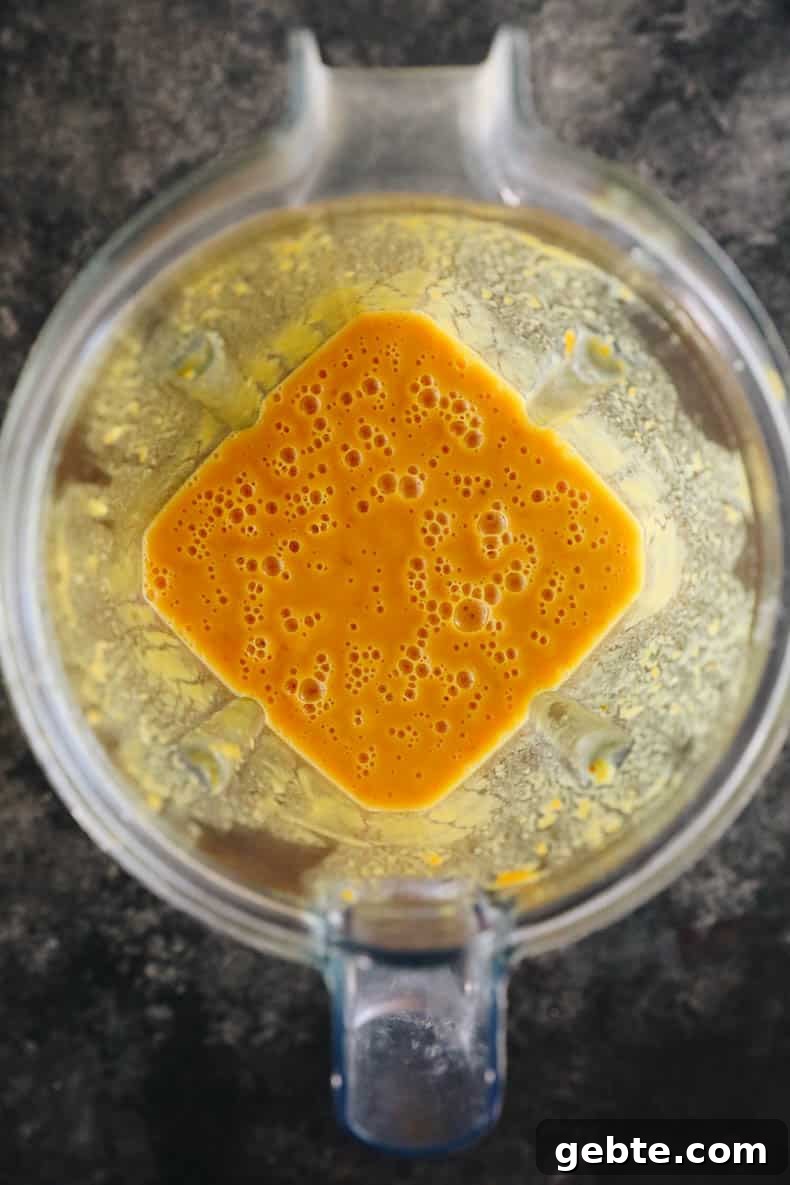 Creamy Curried Sweet Potato Soup Recipe for Cozy Dinners 5 sweet potato soup blended in a blender.