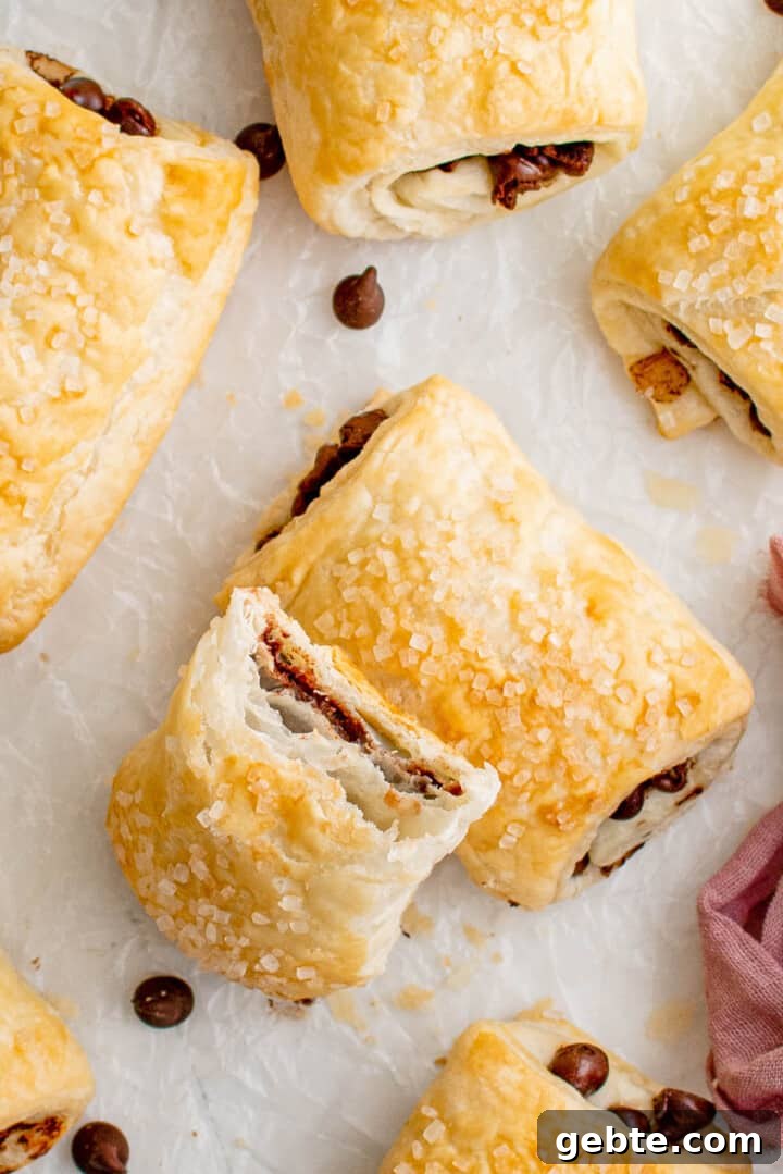 closeup of chocolate puff pastry with bit taken out of it.