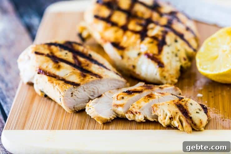 Grilled ranch chicken being sliced on a cutting board