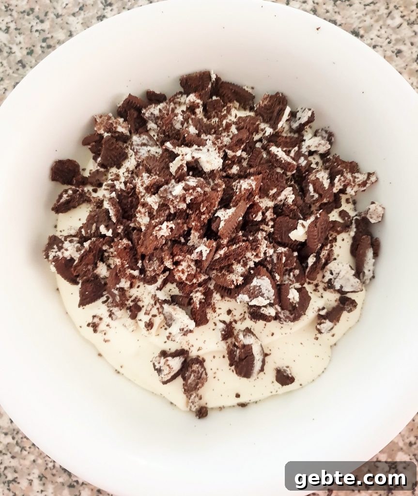 Nutella Cookies and Cream Cheesecake Recipe 15 Crushed Oreos in a cheesecake mixture.