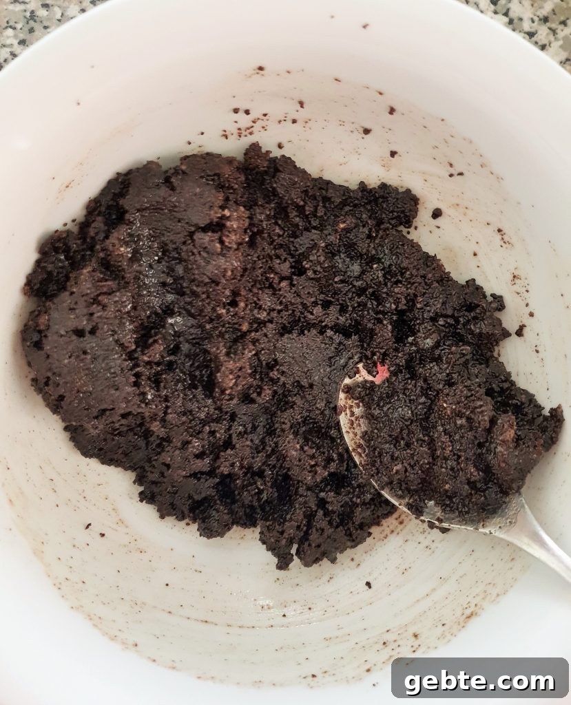 Nutella Cookies and Cream Cheesecake Recipe 6 Oreos mixed in a white bowl.