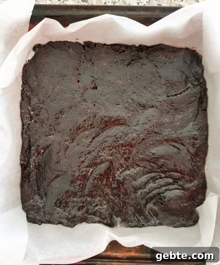 Nutella Cookies and Cream Cheesecake Recipe 7 Oreo crust in a square baking pan.