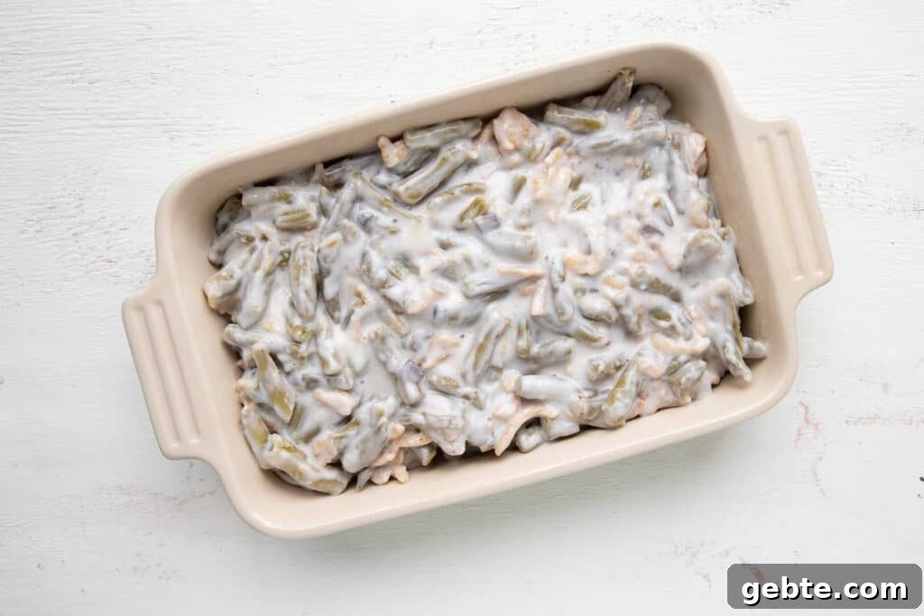 green beans and condensed soup in a casserole dish.