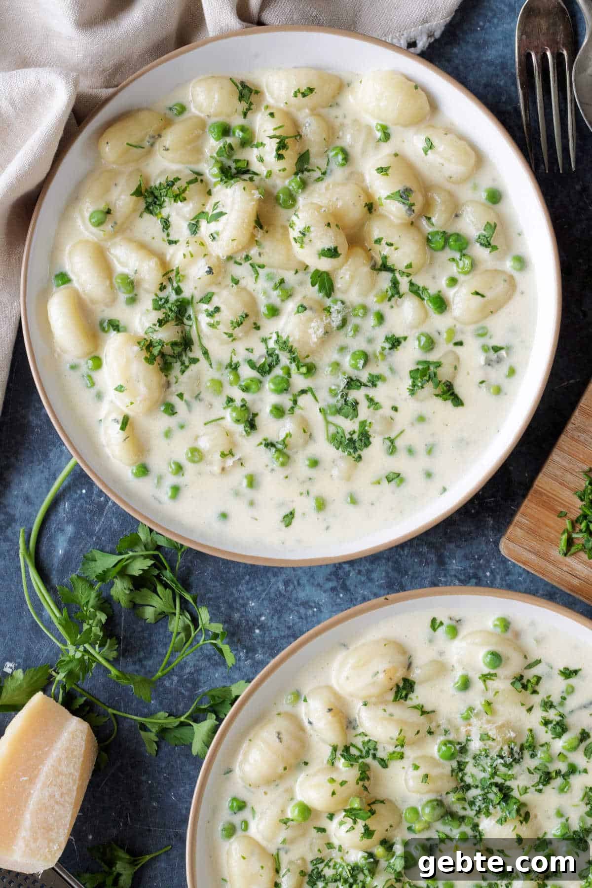 2 plates with creamy gnocchi.