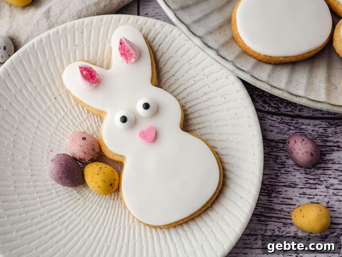 Easter Bunny Cookies Recipe: Step-by-Step Guide 7 Bunny cookie on a plate with mini eggs.