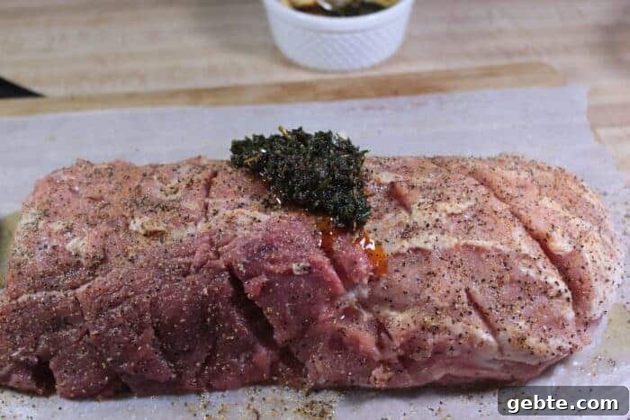 Smoked Pork Loin with Herb Rub 9 Applying herb rub to pork loin