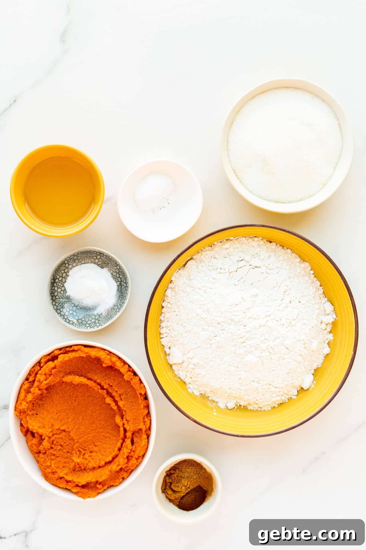 Ingredients to make eggless pumpkin bread include oil, salt, baking soda, sugar, flour, canned pumpkin, and spices