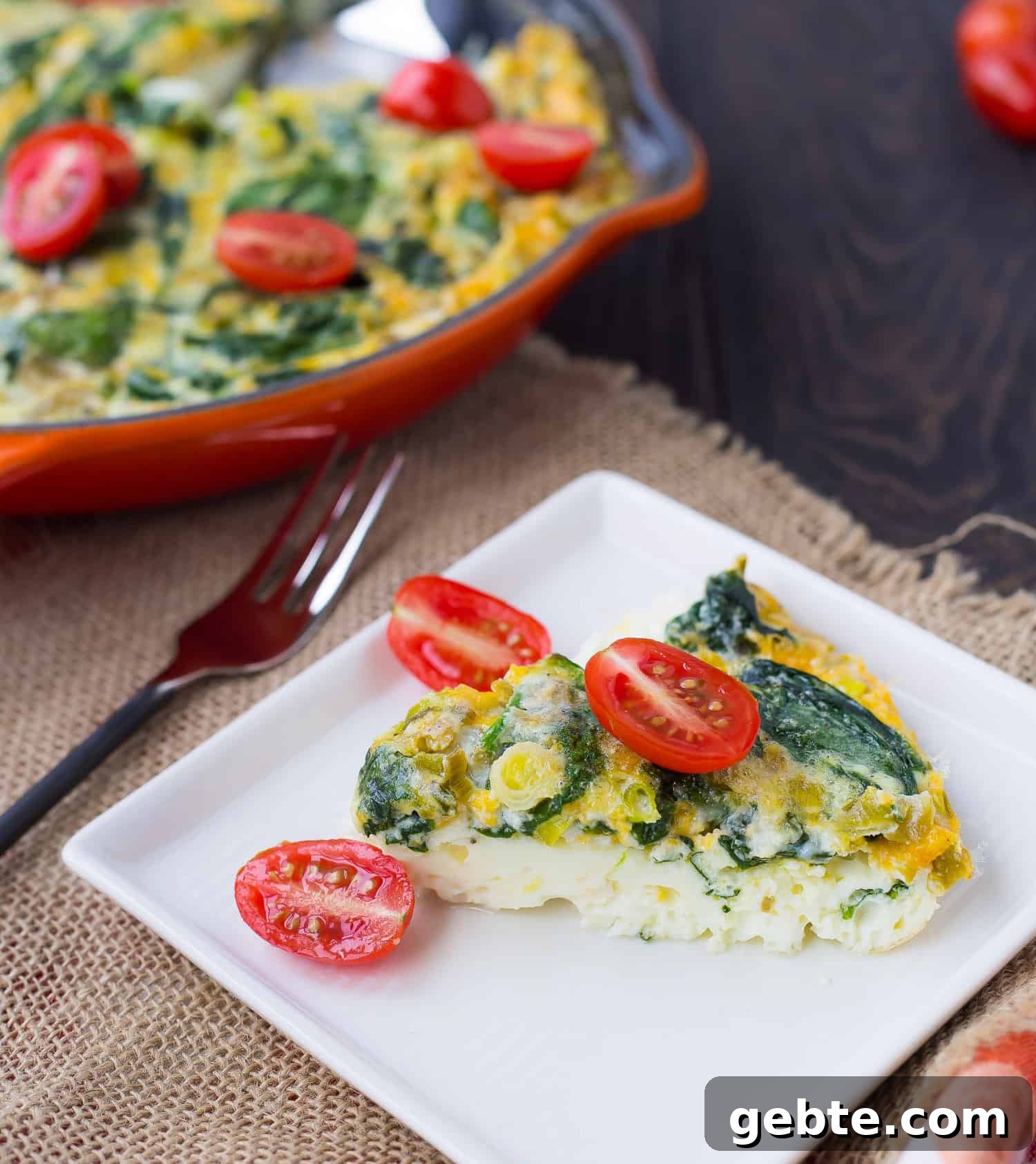 Green Chile Egg White Frittata 4 Slice of egg white frittata on white plate.