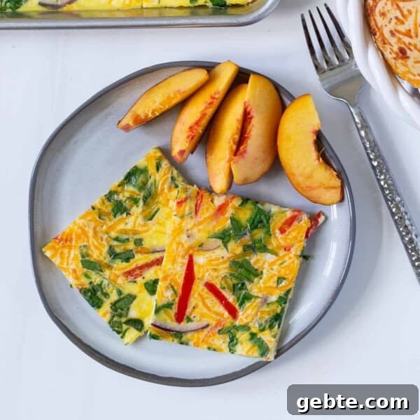 Green Chile Egg White Frittata 6 Sheet pan eggs served on a plate with fresh peaches.