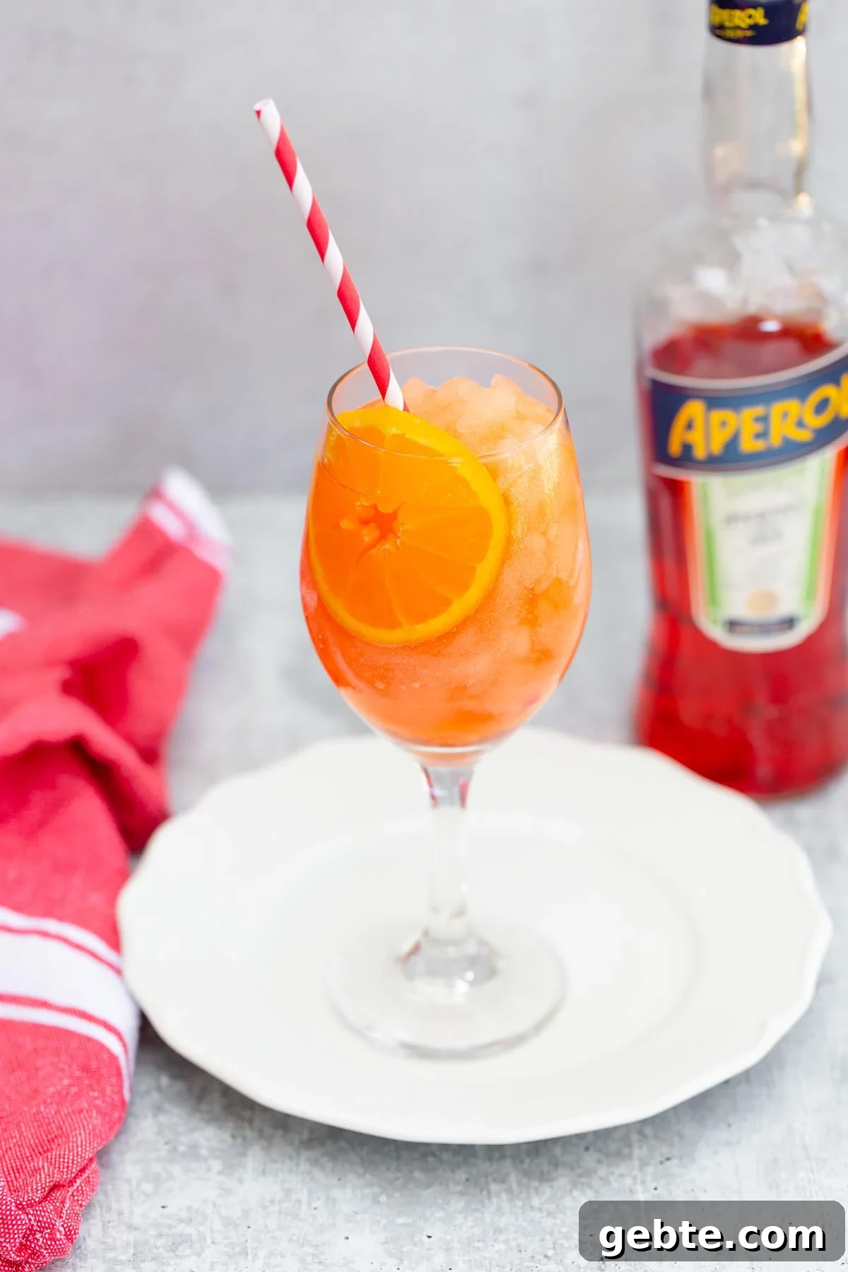frozen aperol spritz with a bottle of aperol