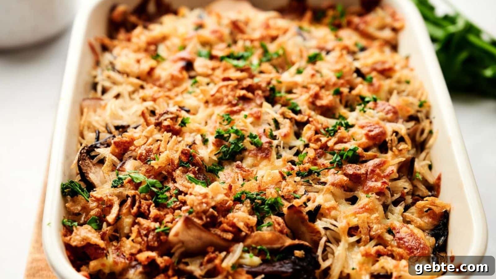 A bowl of pasta with lemon slices and parmesan cheese.