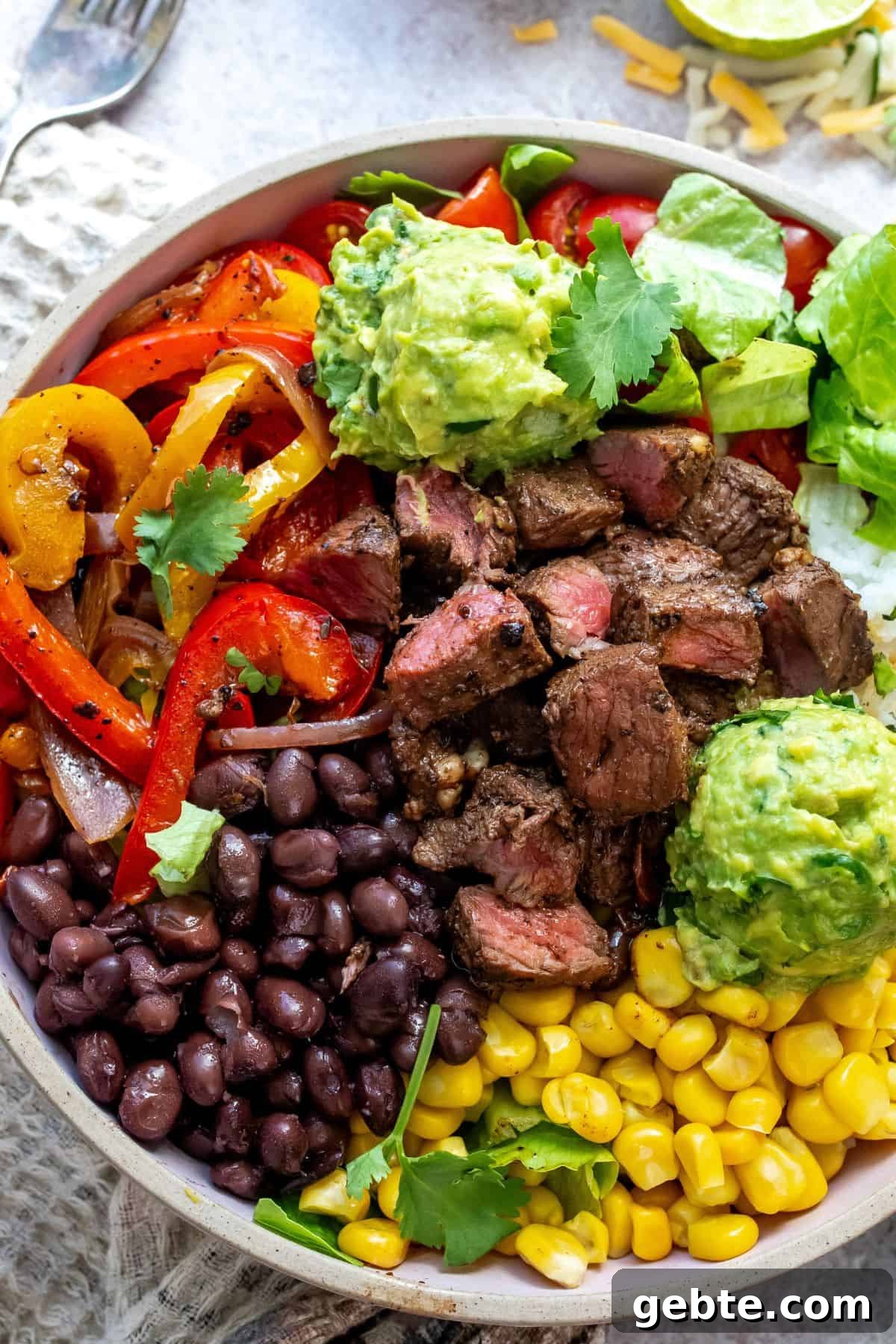 Steak Rice Bowl Recipe with Soy-Garlic Marinade 6 Chipotle Steak Bowls with fork and toppings.