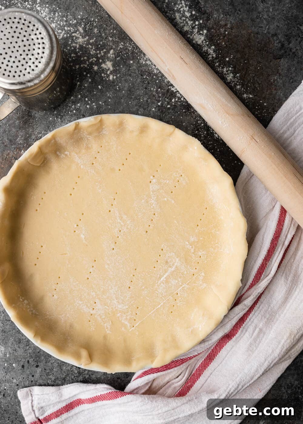 THE easiest lemon tart around. Lazy Mary's Lemon Tart uses an entire Meyer lemon and all the ingredients, besides the tart shell, get mixed in a blender. Smooth, fragrant and delicious! overhead: pie crust pressed into baking pan with rolling pin on side