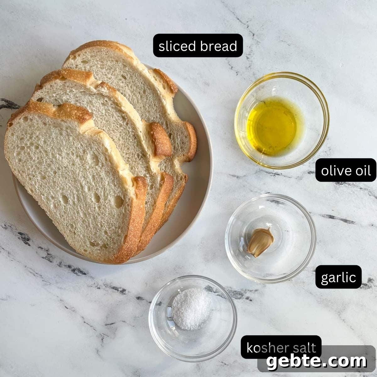 The labeled ingredients for Air Fryer Toast are shown on a white marble counter.