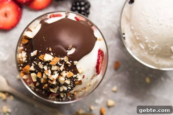 Overhead shot of keto frozen yogurt with magic chocolate shell and nuts