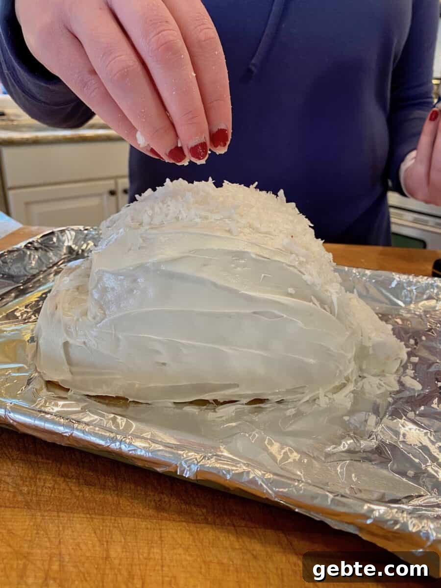 Adding shredded coconut to a frosted cake.