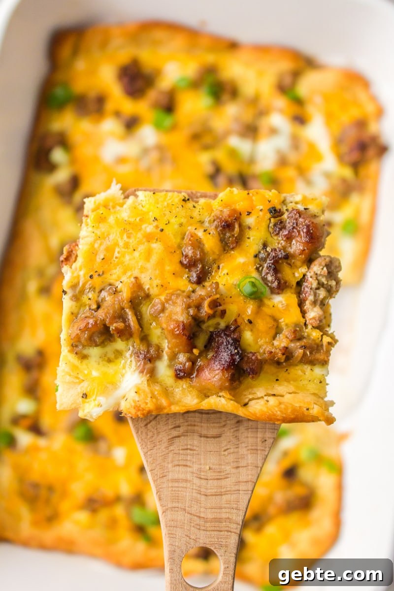 Slice of Easy Brunch Casserole spatula holding piece of easy brunch casserole
