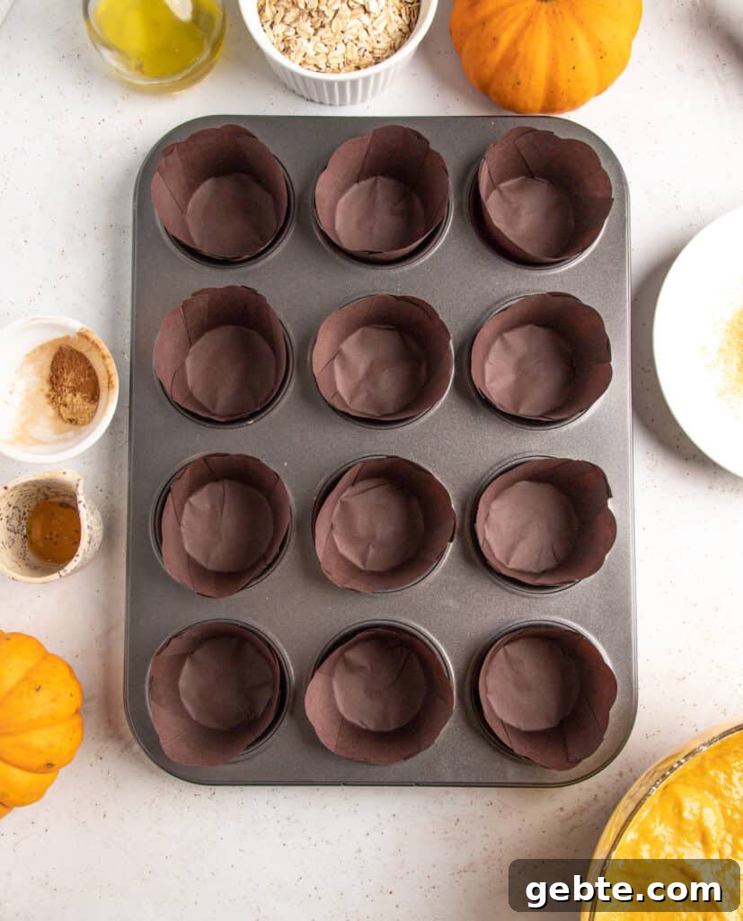 Prepared muffin pan with rustic dark brown paper liners