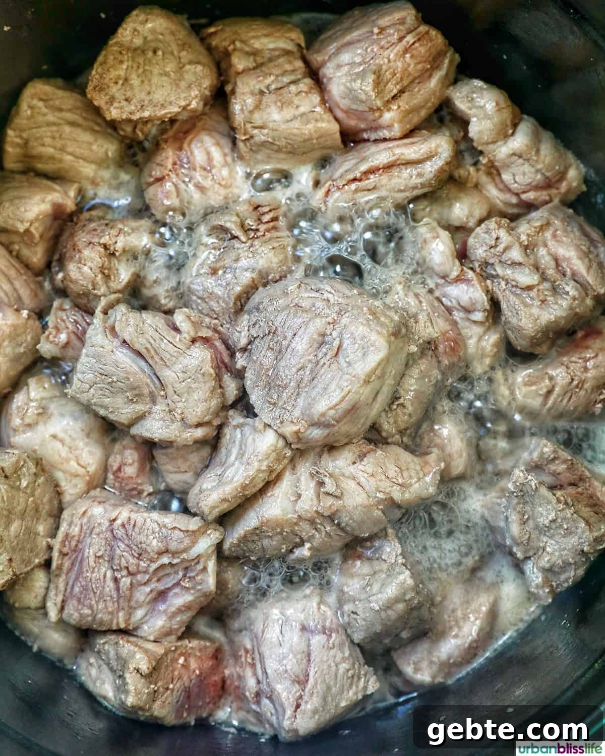 pork cooking in a pot.