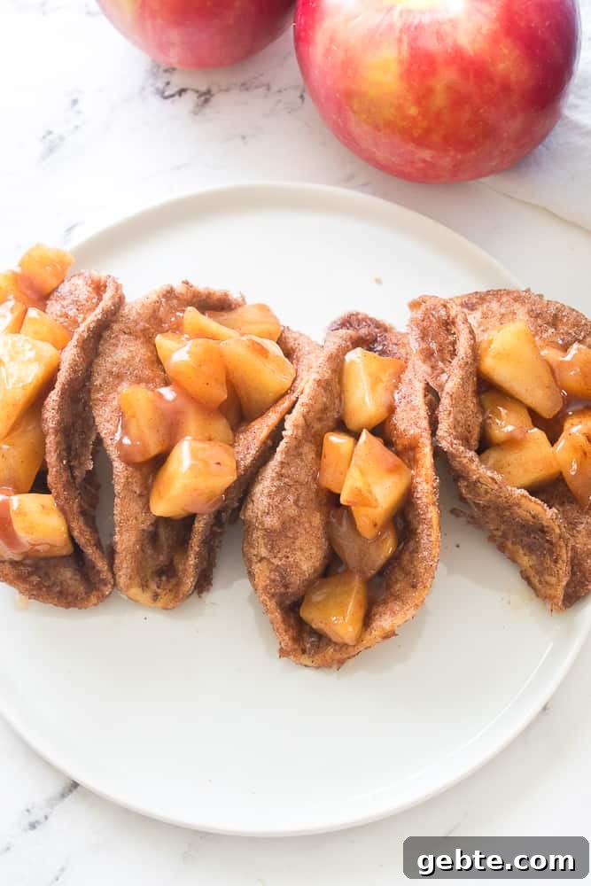 vertical image of apple pie filling in taco shells that have been coated in butter, cinnamon and sugar