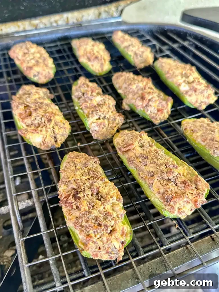 jalapeno poppers on a grill grate 