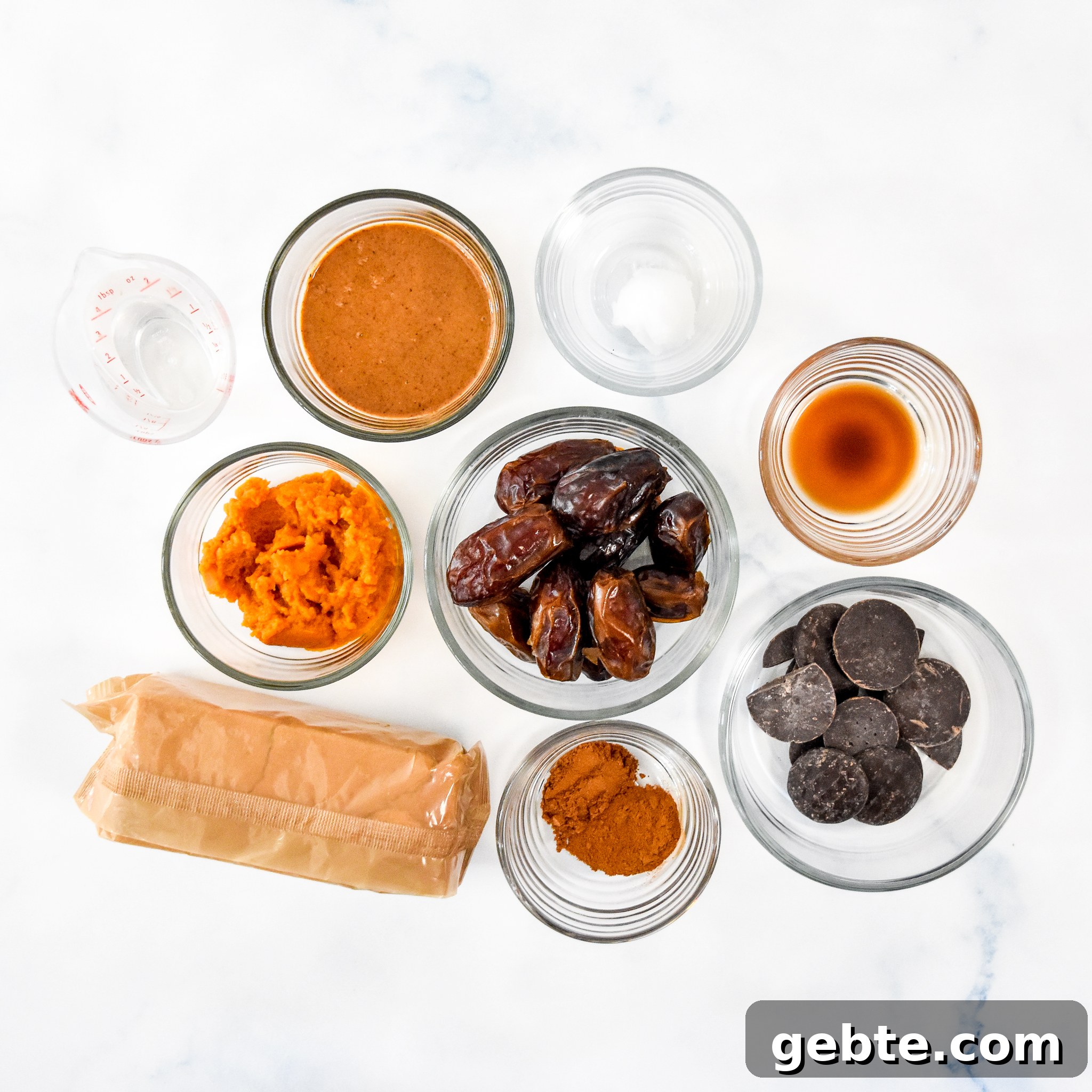 No-Bake Pumpkin Pie Date Balls: Fall Snack Recipe 5 ingredients for the no bake pumpkin pie date balls on a marble counter.