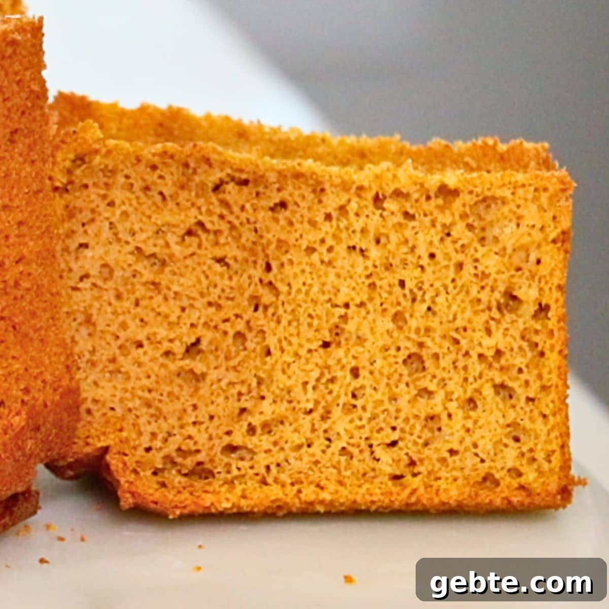 a spice of fluffy pumpkin chiffon cake on a table